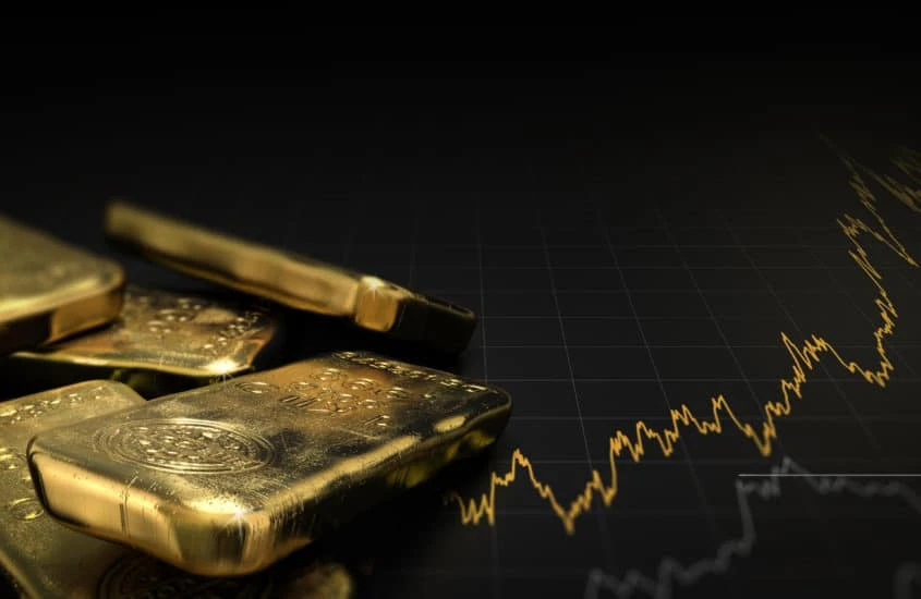 Finanztsunami - Goldbarren auf schwarzem Hinterggrund